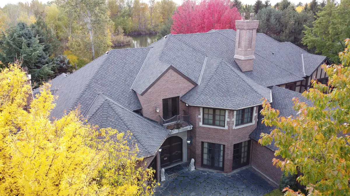 Fall roof maintenance Boise Idaho aerial view autumn colors