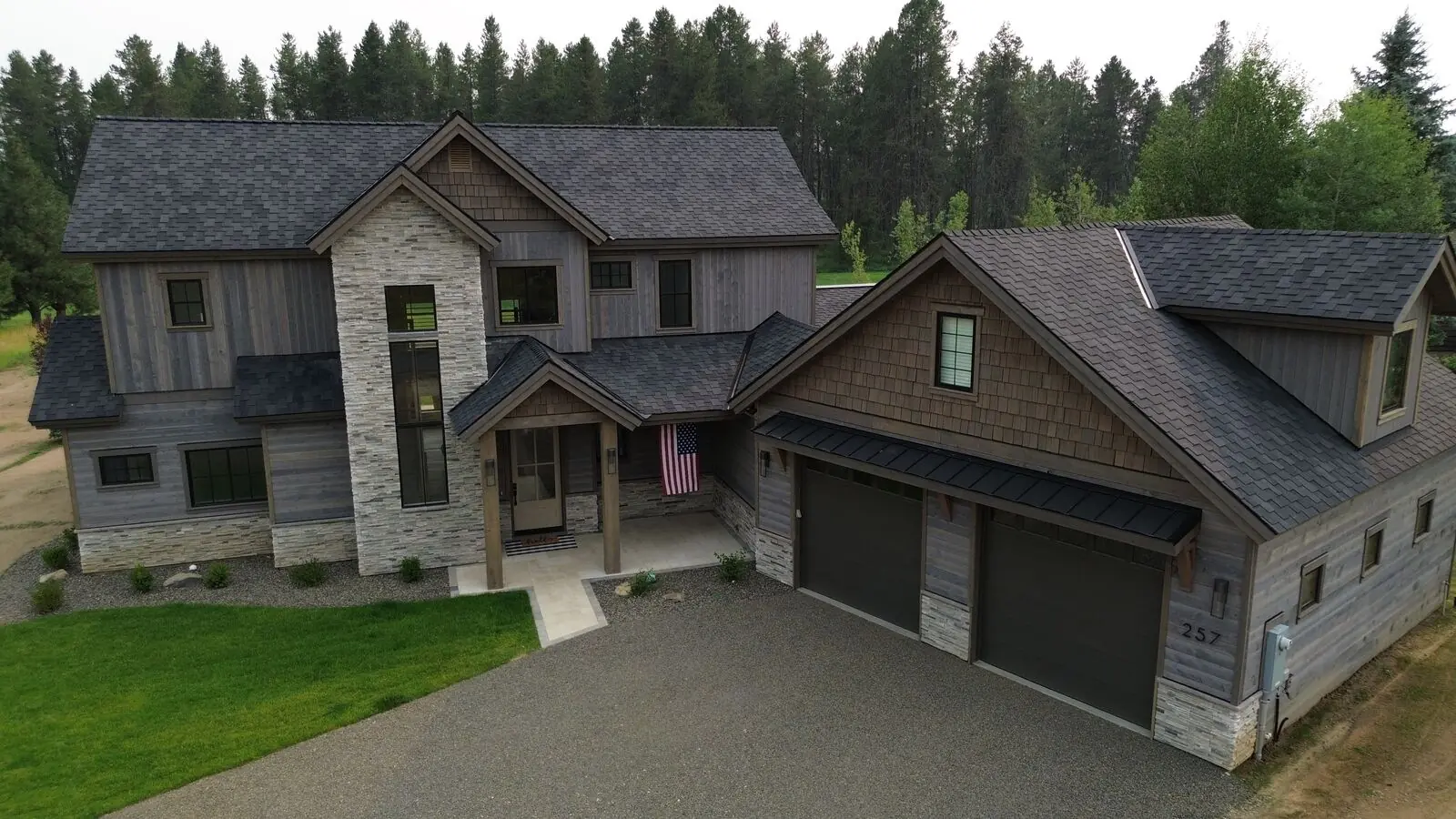 Modern farmhouse home with new charcoal shingles in New Meadows Idaho - Blue Goat Roofing